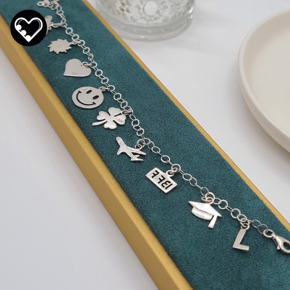 Rolo bracelet with mini graduation charms